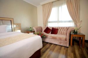 Voodi või voodid majutusasutuse Cairo Taj Hotels & Suites - Dokki toas