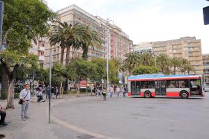 a bus driving down a street in a city at Room and Suite - BARI CENTRALE - in Bari