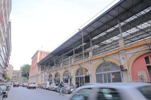 a city street with cars parked in front of a building at Room and Suite - BARI CENTRALE - in Bari +8 photos