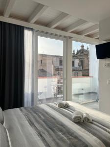 Postel nebo postele na pokoji v ubytování Papireto Rooms