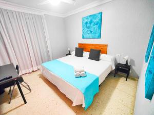 Posteľ alebo postele v izbe v ubytovaní Hotel Don Cándido