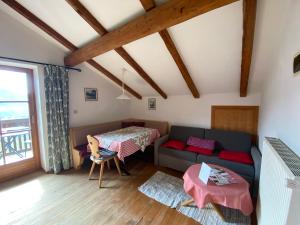 a living room with a couch and a table at Residence Streitlhof in Tirolo