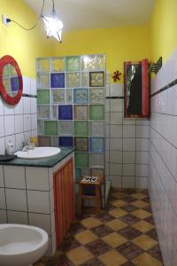 a bathroom with a sink and a toilet at La Gallina Felice B&B in Meta +66 photos