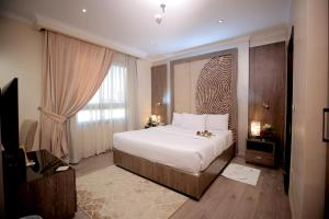 Voodi või voodid majutusasutuse Cairo Taj Hotels & Suites - Dokki toas