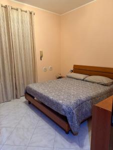 Postel nebo postele na pokoji v ubytování Ta maison e Ta maison oro