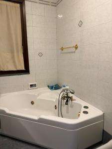 Koupelna v ubytování Ta maison e Ta maison oro