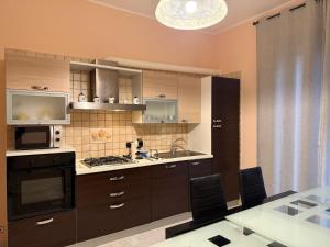 Kuchyň nebo kuchyňský kout v ubytování Ta maison e Ta maison oro