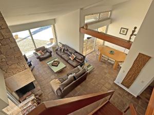 an overhead view of a living room with couches and a table at Villa San Michele - 70's experience in Salernes