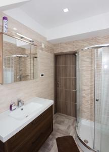 a bathroom with a sink and a shower at Relax Bovec in Bovec +54 photos