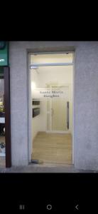 a window of a store with a door in it at Mellieha, Charming 2 Bedroom Apartment Santa Maria Heights Mellieha in Mellieħa
