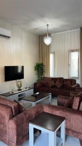 TV a/nebo společenská místnost v ubytování Murooj AlSifah