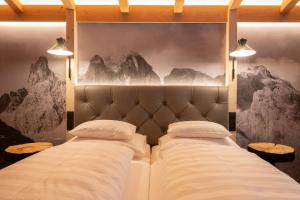 Postel nebo postele na pokoji v ubytování Boutiquehotel Grandau