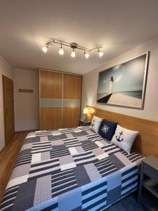 Posteľ alebo postele v izbe v ubytovaní Apartament Marcin