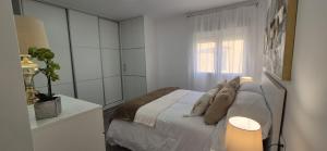 Postel nebo postele na pokoji v ubytování Casa Alpha