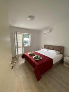 Ένα ή περισσότερα κρεβάτια σε δωμάτιο στο Apartments Belin