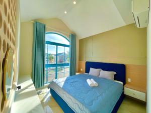 Ένα ή περισσότερα κρεβάτια σε δωμάτιο στο Villa Novaworld 2 Phòng Ngủ