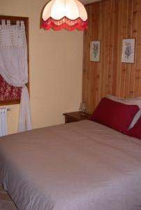 a bedroom with a large bed and a window at Baita Amiata in Monte Amiata
