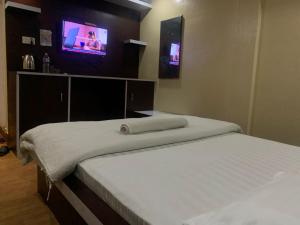 Postel nebo postele na pokoji v ubytování Hotel Sports Pvt Ltd