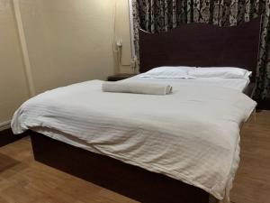 Postel nebo postele na pokoji v ubytování Hotel Sports Pvt Ltd