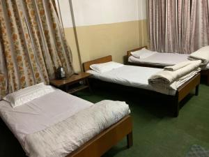 Postel nebo postele na pokoji v ubytování Hotel Sports Pvt Ltd