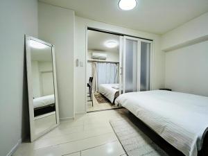 Ένα ή περισσότερα κρεβάτια σε δωμάτιο στο ShinjukuFleur-401