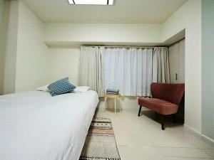 Ένα ή περισσότερα κρεβάτια σε δωμάτιο στο ShinjukuFleur-401