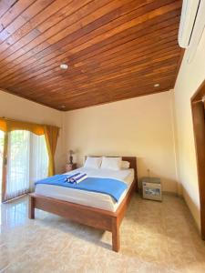 Katil atau katil-katil dalam bilik di Villa Indah Anugrah
