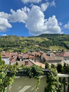 a view of a town with buildings and trees at Lysgaard Cosy Cottage in La Bresse