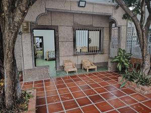 a rendering of a building with benches and trees at Casa yamulemao in Cartagena de Indias +17 photos