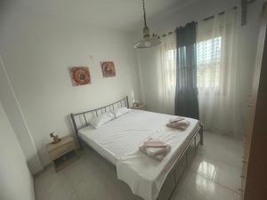 Ένα ή περισσότερα κρεβάτια σε δωμάτιο στο Ariana's apartment