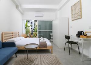 Voodi või voodid majutusasutuse Loveinsky Tel Aviv rooms toas