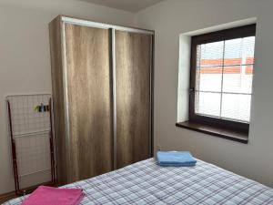 Posteľ alebo postele v izbe v ubytovaní Apartmán u Hovorků