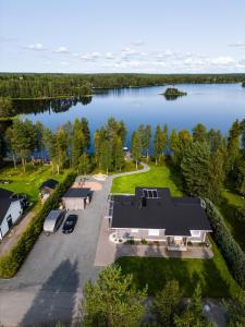 an aerial view of a house on a lake at Villa beach star in Ranua