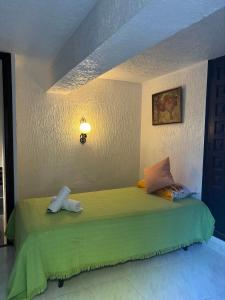Ein Bett oder Betten in einem Zimmer der Unterkunft Villa Puerto Blanco