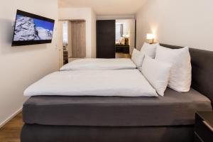 En eller flere senge i et værelse på FeWo-Bergromantik mit Sauna und Pool