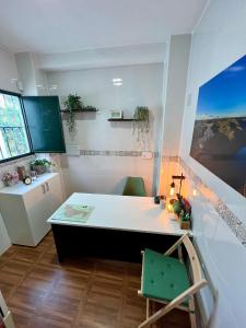 a room with a desk and a table and a window at Complejo Rural Mirador de la Alcaidía in Hornachuelos