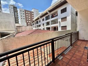 a balcony with a view of a building at Apartamento a beira-mar in Capão da Canoa