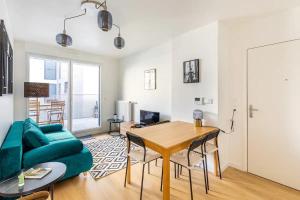 Televízia a/alebo spoločenská miestnosť v ubytovaní Your cosy apartment close to Paris + 14 fotografií