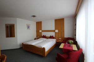 Postel nebo postele na pokoji v ubytování Hotel Garni Bel-Ami