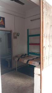 a bedroom with two bunk beds and a mirror at kesharwani homes in Prayagraj