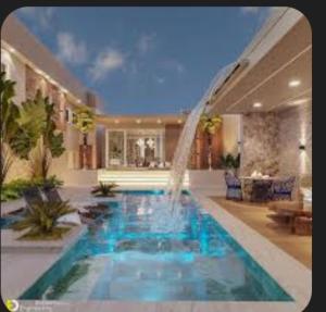 una piscina con una fuente en una casa en Roza, en Hiret