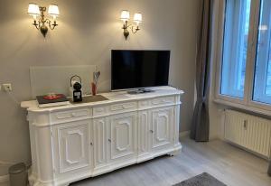 TV a/nebo společenská místnost v ubytování SEEBLICK APARTMENTS Im Zentrum