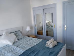 Postel nebo postele na pokoji v ubytování Lara Luna + 2 fotografie