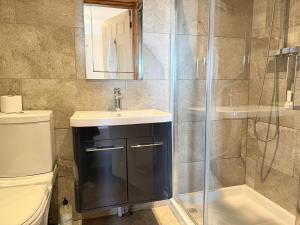 a bathroom with a sink and a shower at Standlow Farm in Kniveton +39 photos