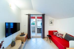 Μια τηλεόραση ή/και κέντρο ψυχαγωγίας στο Apartment Pijaceta