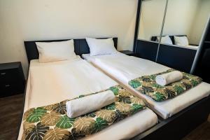 Postel nebo postele na pokoji v ubytování Siocamping Házak Homes