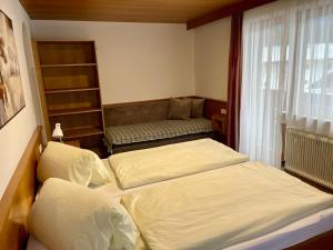 Postel nebo postele na pokoji v ubytování Haus Gröblacher