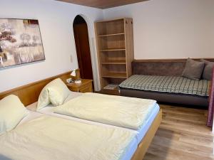 Postel nebo postele na pokoji v ubytování Haus Gröblacher