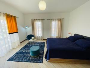 Ein Bett oder Betten in einem Zimmer der Unterkunft Tia Vahine