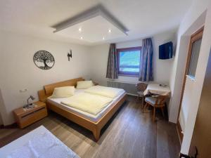 Postel nebo postele na pokoji v ubytování Haus Gröblacher